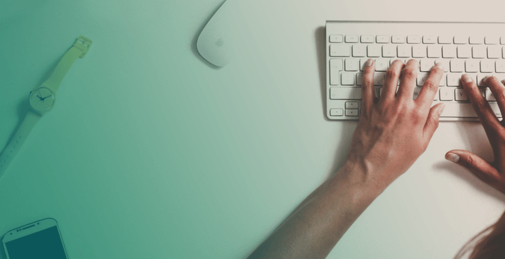 Hands typing on a keyboard.