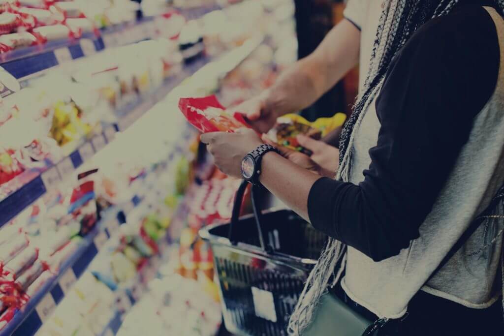A couple shopping for food together