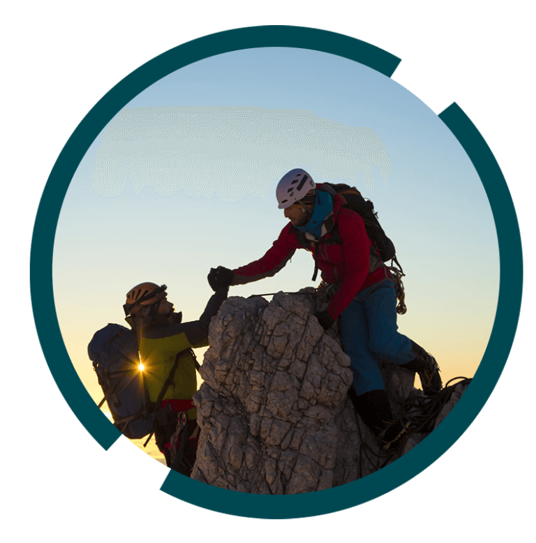 Hikers and climbers helping each other at the summit.